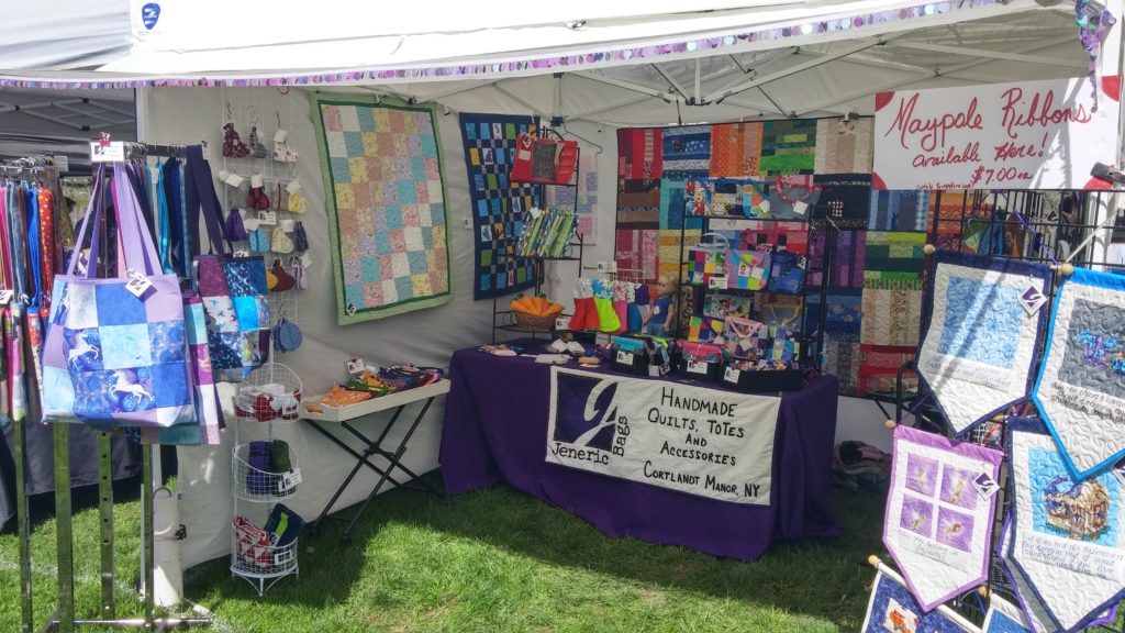 Our booth at a craft fair with our wide variety of handmade items for sale